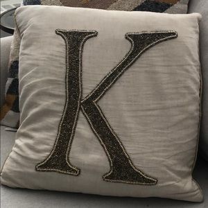 K letter beaded accent pillow
